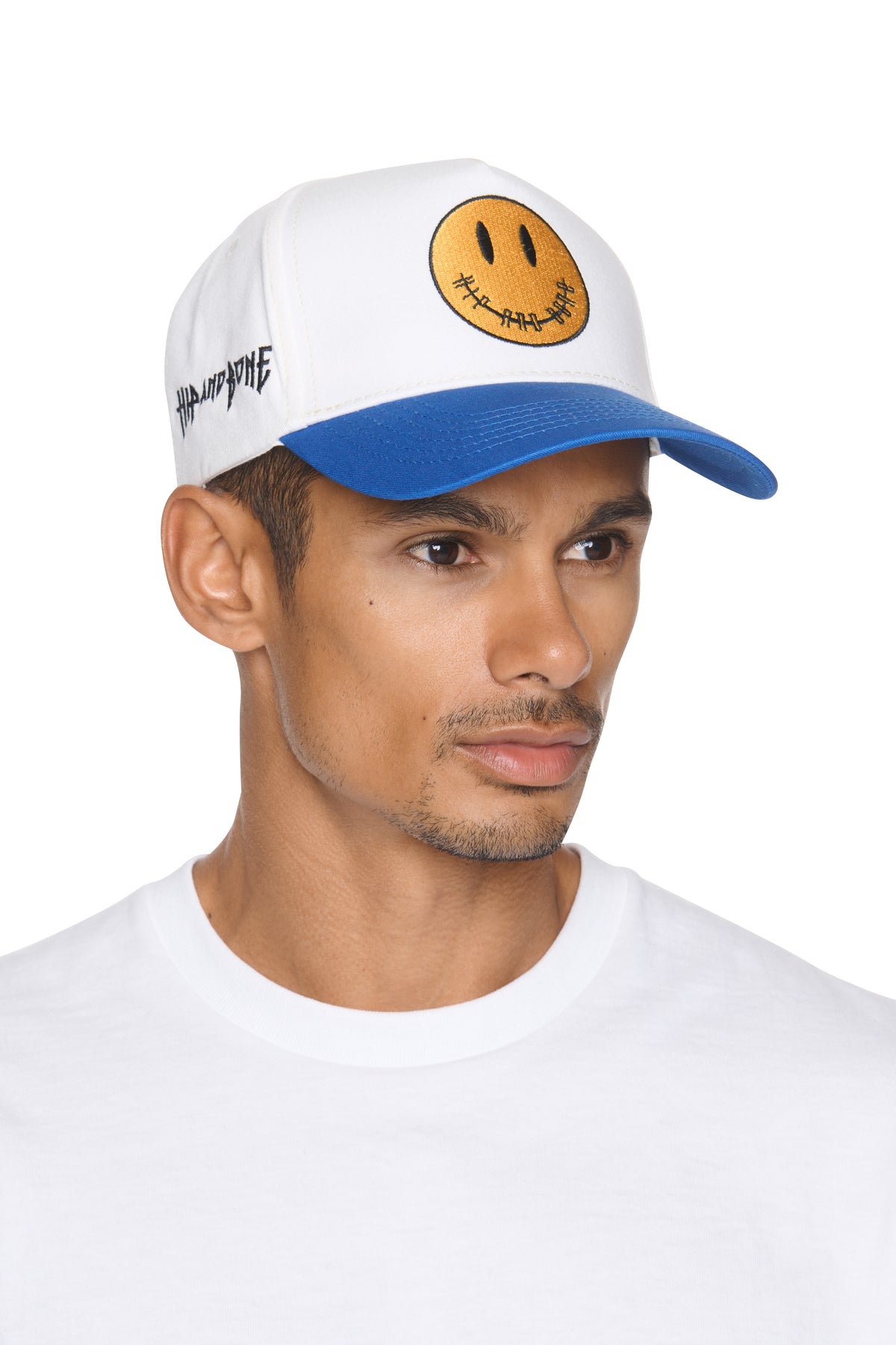 GORRA BICOLOR DE ALGODÓN CEPILLADO CON CARITA SONRIENTE Y CIERRE AJUSTABLE